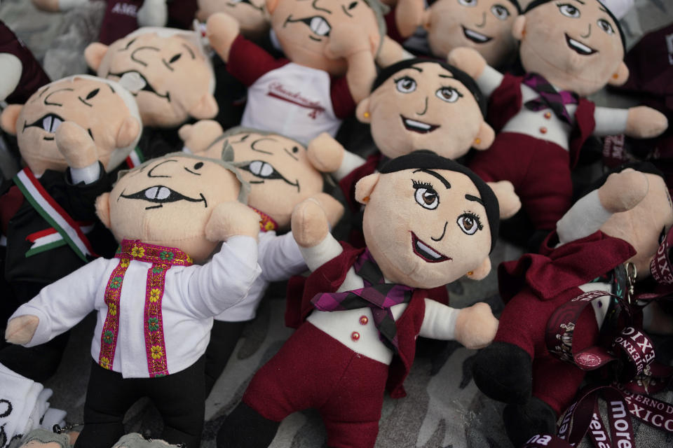 FILE - Dolls representing presidential candidate Claudia Sheinbaum, alongside current President Andrés Manuel López Obrador, are for sale at her opening campaign rally at the Zocalo in Mexico City, March 1, 2024. General Elections are set for June 2. (AP Photo/Aurea Del Rosario, File)