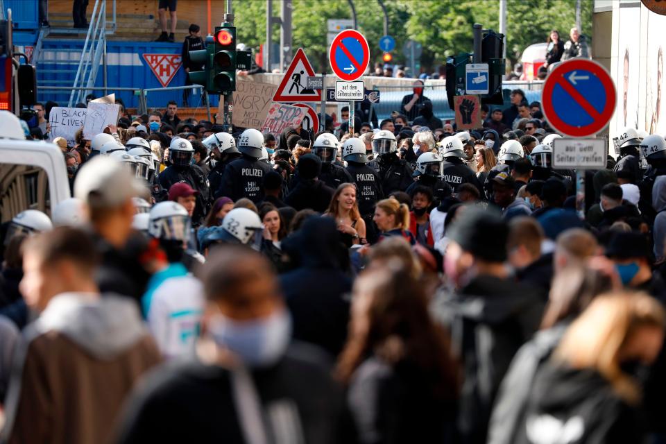 <p>Police stands guard during a BLM protest on June 6 in Hamburg</p>AFP via Getty Images