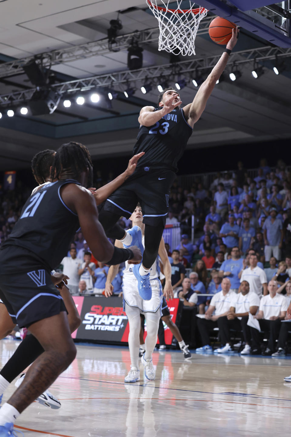 In a photo provided by Bahamas Visual Services, Villanova's Tyler Burton shoots the ball during the first half of an NCAA college basketball game in the Battle 4 Atlantis at Paradise Island, Bahamas, Thursday, Nov. 23, 2023. (Tim Aylen/Bahamas Visual Services via AP)