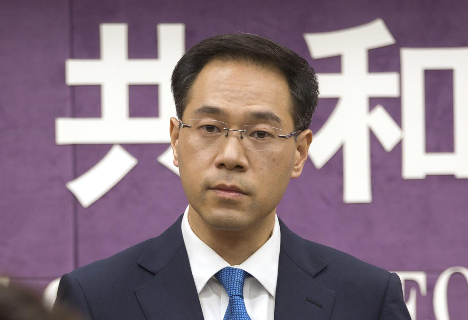 FILE - In this March 29, 2018, file photo, Chinese Ministry of Commerce spokesman Gao Feng listens to a reporter's question during a press conference at the Ministry of Commerce in Beijing. A Chinese Commerce Ministry official says Beijing is working to resolve conflicts with Washington over trade, dismissing speculation the talks might be in trouble as unreliable “rumors.” Ministry spokesman Gao Feng said Thursday he could not disclose any new information. But he said China was committed to working toward an agreement. (AP Photo/Mark Schiefelbein, File)