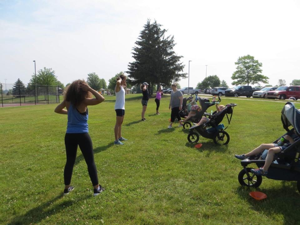 Kyria Phenix leads a stroller classes through Fit4Mom Holland during the organization's grand reopening Saturday, June 12.