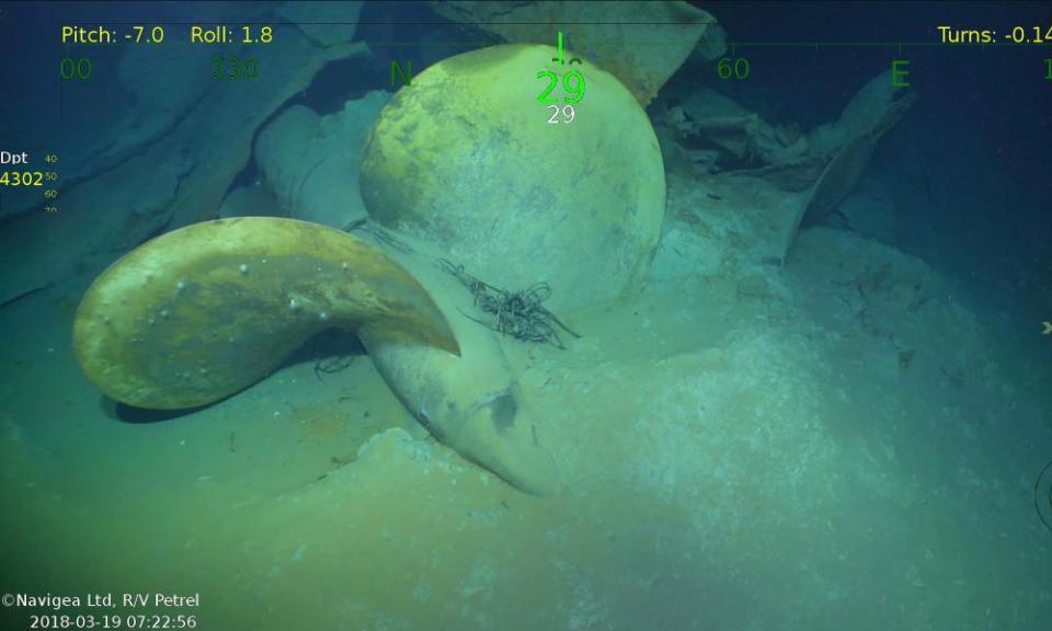 An underwater video image shows a propeller, part of wreckage from the USS Juneau.