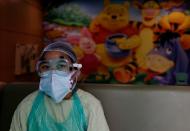 Medical workers treat patients infected with the coronavirus disease (COVID-19) at a hospital in New Delhi