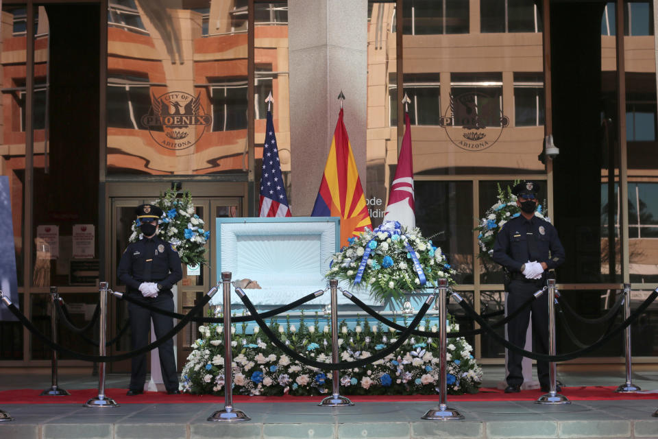 Calvin C. Goode is laid at state in front of Calvin C. Goode Municipal Building in Phoenix, on Saturday, Jan. 9, 2021. Family members and members of the community attended the public, socially distanced viewing for Goode who died on Wednesday, Dec. 23, 2020. He was 93. (AP Photo/Cheyanne Mumphrey)