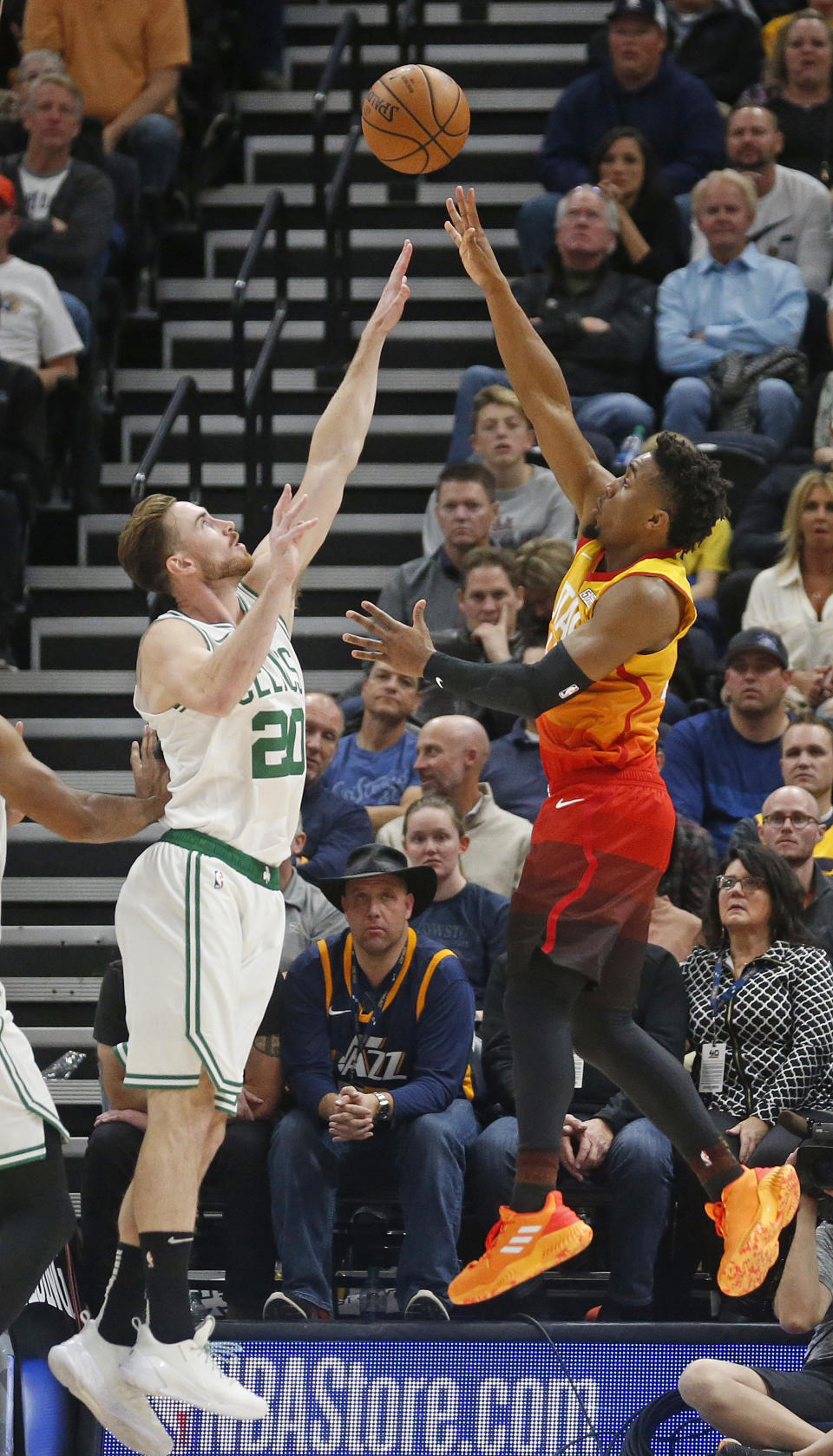 Utah Jazz guard Donovan Mitchell, right, shoots as Boston Celtics forward Gordon Hayward defends during the second half of an NBA basketball game Friday Nov. 9, 2018, in Salt Lake City. (AP Photo/Rick Bowmer)