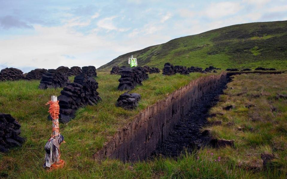 Scottish traditional peat cutting and drying in the highlands of Sutherland, Scotland - Alamy