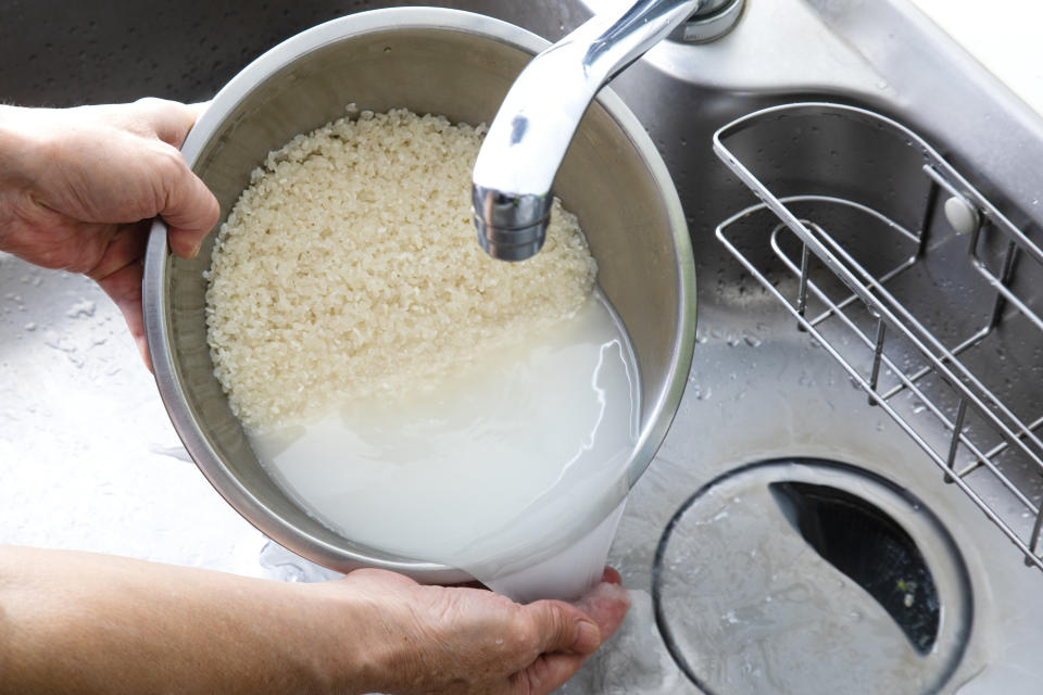 Washing rice in the sink