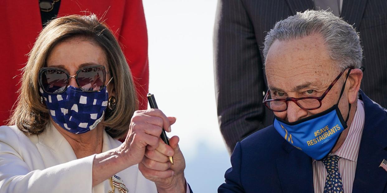 Nancy Pelosi Chuck Schumer holding pen