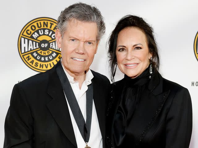 <p>Jason Kempin/Getty</p> Randy Travis and Mary Davis attend the Class of 2023 Medallion Ceremony at Country Music Hall of Fame and Museum on October 22, 2023 in Nashville, Tennessee.