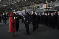 Britain's Queen Elizabeth II, left, meets personnel, during a visit to HMS Queen Elizabeth at HM Naval Base, ahead of the ship's maiden deployment, in Portsmouth, England, Saturday May 22, 2021. HMS Queen Elizabeth will be leading a 28-week deployment to the Far East that Prime Minister Boris Johnson has insisted is not confrontational towards China. (Steve Parsons/Pool Photo via AP)