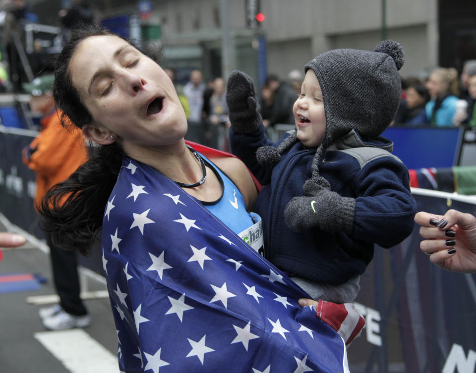 Kara Goucher told the New York Times she was forced to choose between getting paid and spending time with her sick son. (AP)