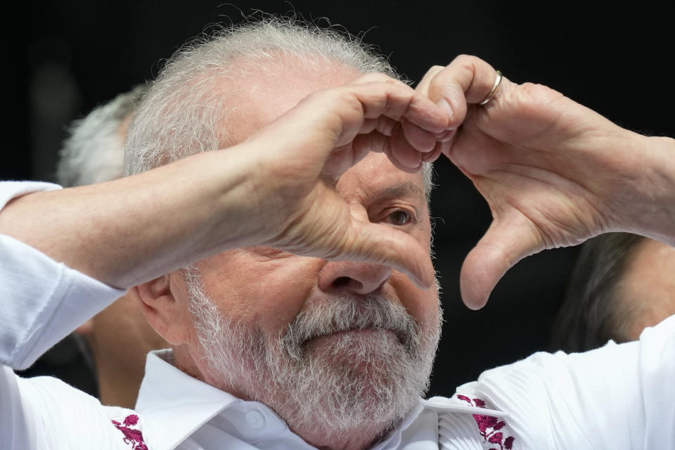 Brazilian President Luiz Inacio Lula da Silva gestures to supporters during a May Day rally in Sao Paulo, Brazil, Monday, May 1, 2023. (AP Photo/Andre Penner)