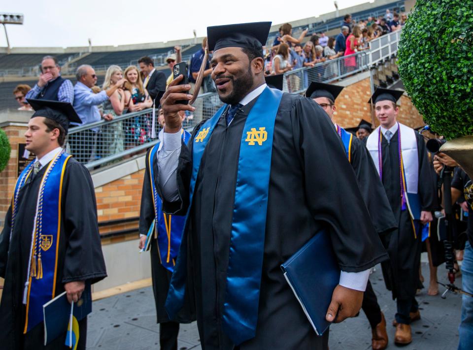 Jerome Bettis takes a video as he walks into the stadium during the Notre Dame Commencement ceremony Sunday, May 15, 2022 at Notre Dame Stadium in South Bend. 