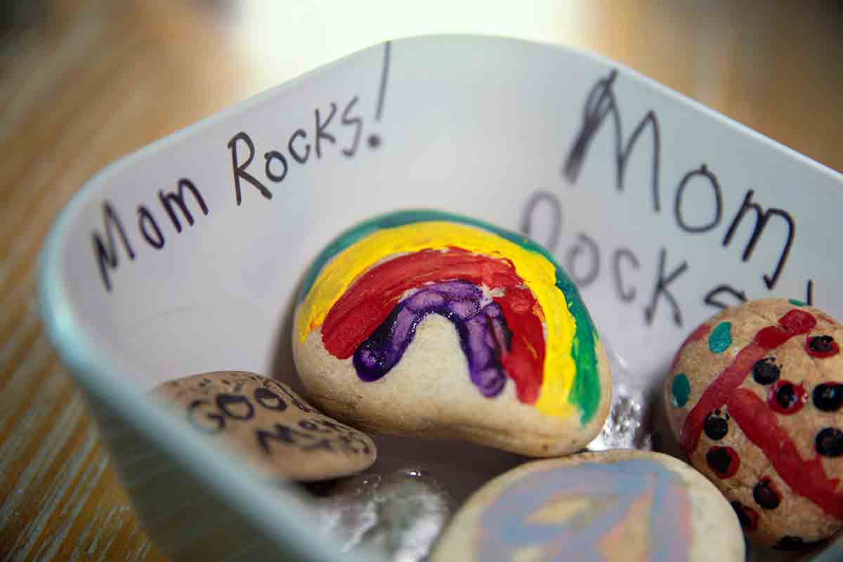 This photo shows a pile of hand-painted rocks.