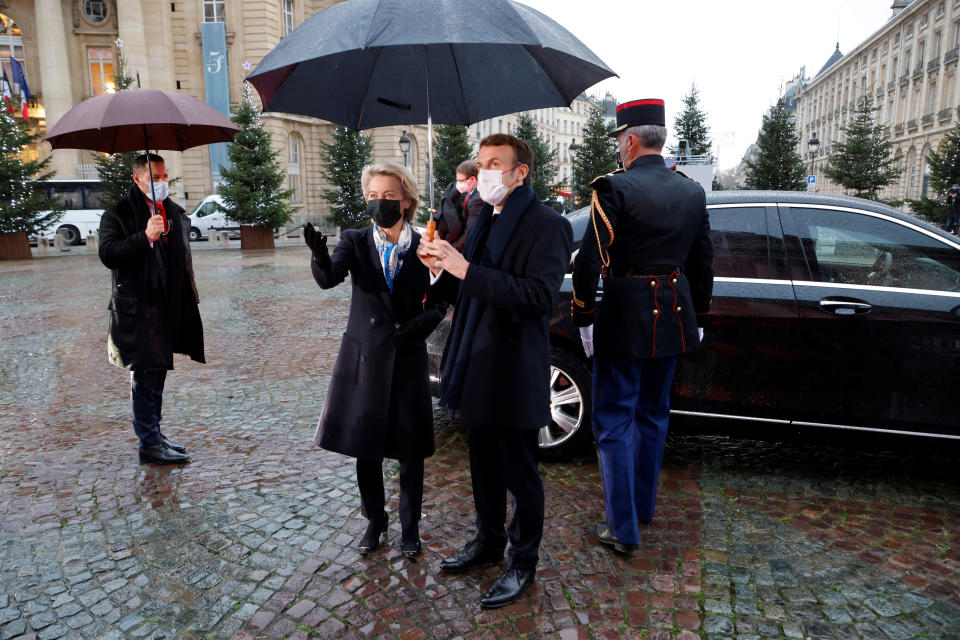 France's President Emmanuel Macron, center right, welcomes European Commission president Ursula von der Leyen before a ceremony to pay tribute to late French politician Simone Veil and diplomat Jean Monnet, at the French Pantheon in Paris, Friday, Jan. 7, 2022. French president Emmanuel Macron paid a tribute to a pair of leading European figures Friday as France formally took the reins of the 27-nation bloc for the next six months with big ambitions. (Ludovic Marin, Pool Photo via AP)