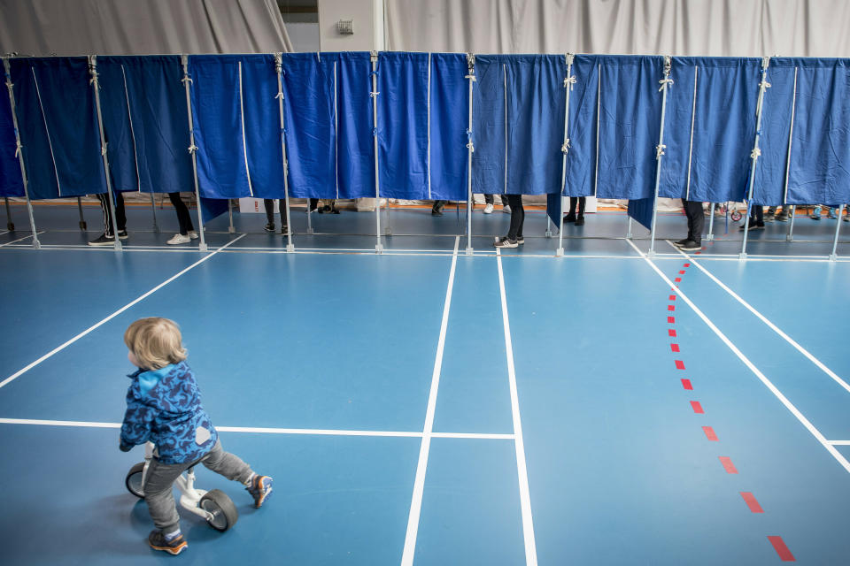 People vote at the Groendal Center in Copenhagen during the European Parliament elections 2019, Sunday May 26, 2019.(Mads Claus Rasmussen/Ritzau Scanpix via AP)