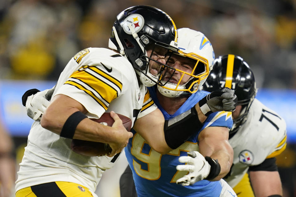 Los Angeles Chargers defensive end Joey Bosa, right, sacks Pittsburgh Steelers' Ben Roethlisberger during the second half of an NFL football game Sunday, Nov. 21, 2021, in Inglewood, Calif. (AP Photo/Ashley Landis)