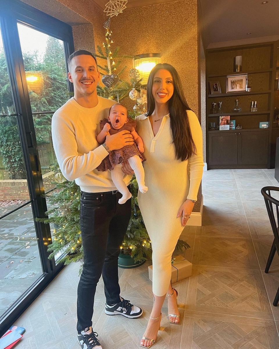 Zoe Plastiras pictured with her partner and new baby.