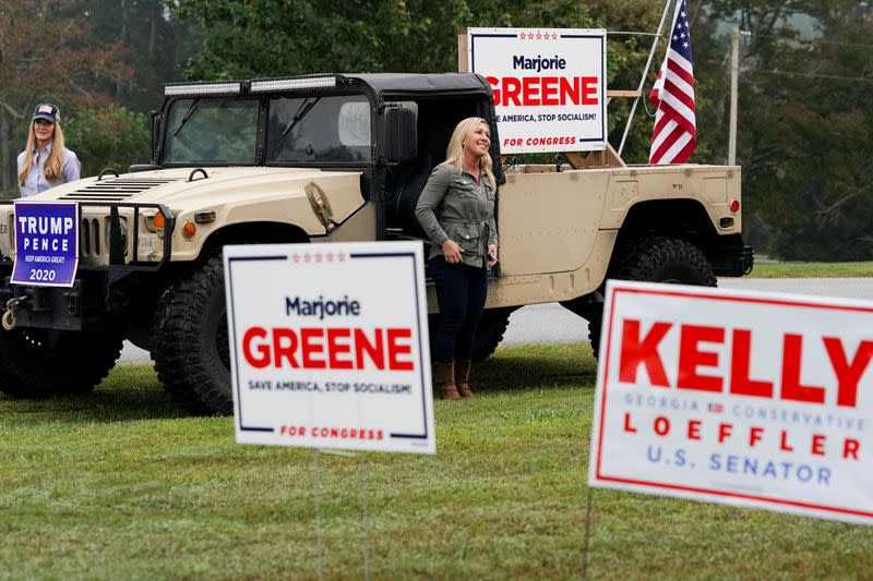 U.S. Senator Kelly Loeffler and Marjorie Taylor Greene speak at a news conference in Dallas