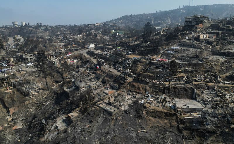 Damaged buildings are seen, following the spread of wildfires in Vina del Mar