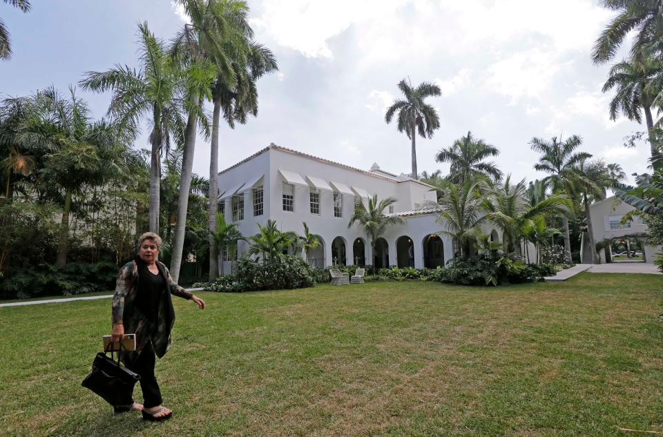 Deirdre Marie Capone, grandniece of Al Capone, walks in the backyard of the waterfront mansion once owned by Al Capone.