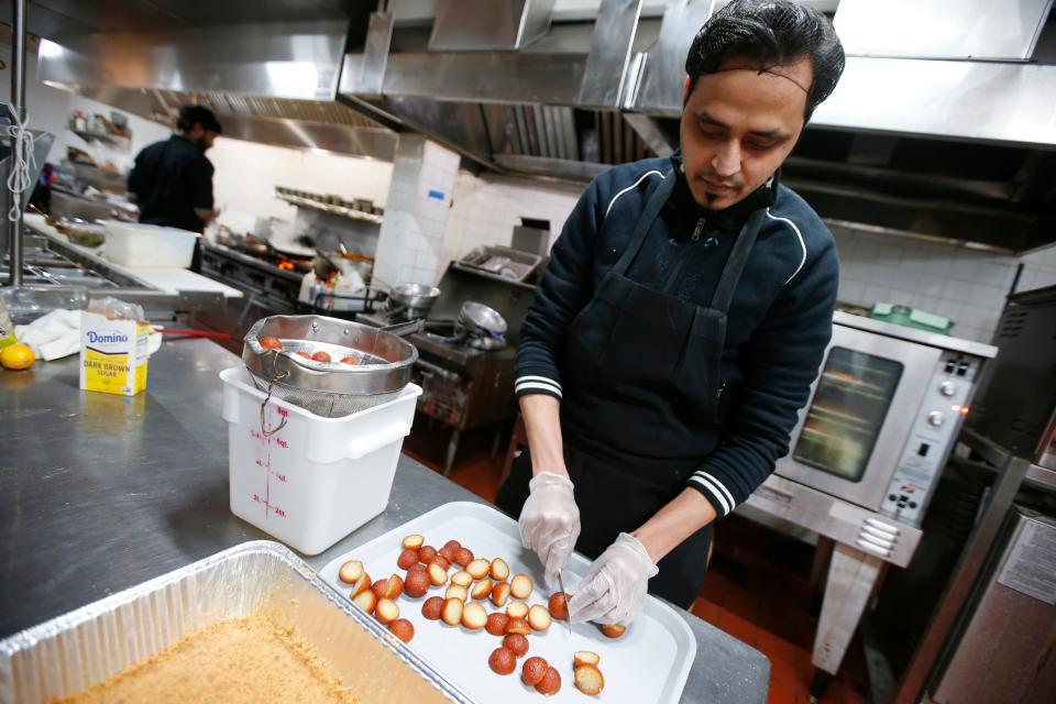 Pastry chef, Ranjan Shinde, prepares a dessert at the newly opened Saffron by the Sea in Fairhaven.