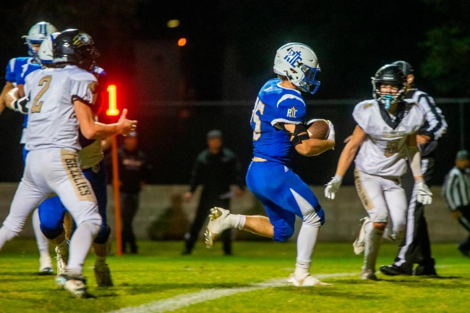 Dax Beidleman, 25, of Ripon Christian gains yards during the first half of play against Golden Sierra Friday Nov. 03, 2023 at Ripon Christian.