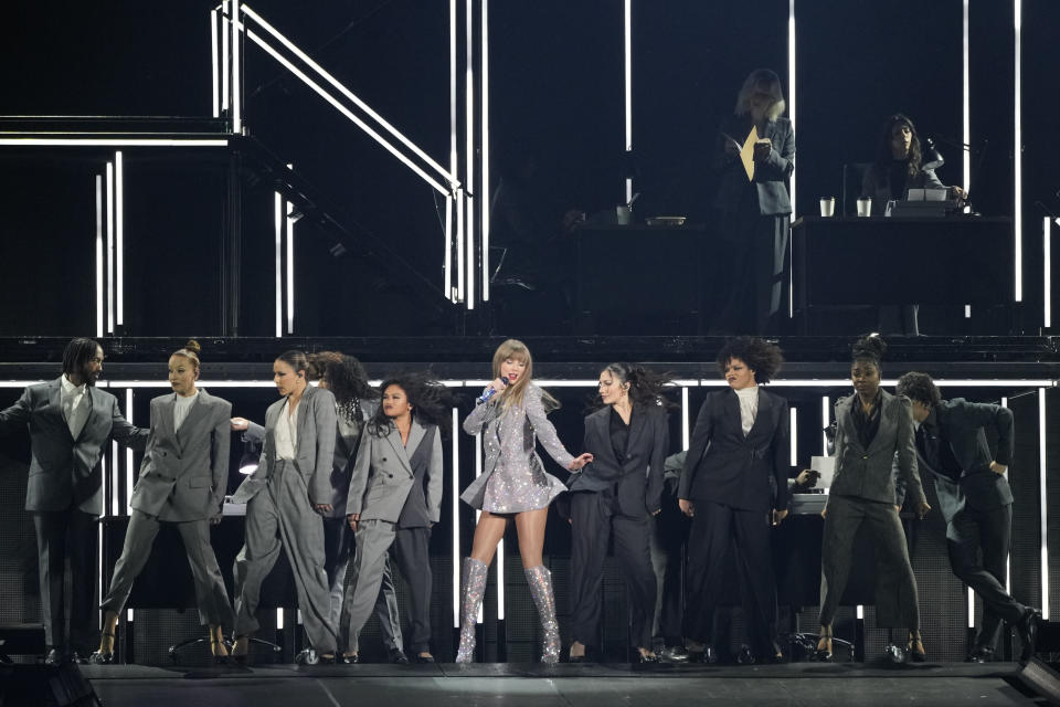 Taylor Swift, center, performs during the opener of her Eras tour Friday, March 17, 2023, at State Farm Stadium in Glendale, Ariz. (AP Photo/Ashley Landis)