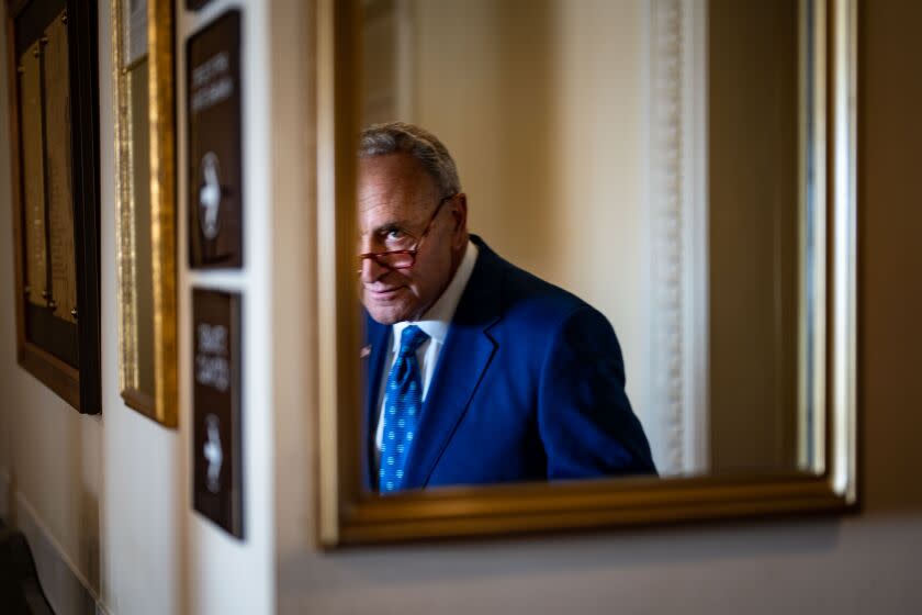 WASHINGTON, DC - AUGUST 07: Senate Majority Leader Chuck Schumer (D-NY) seen reflected in a mirror departs a news conference on the passage of the Inflation Reduction Act at the U.S. Capitol on Sunday, Aug. 7, 2022 in Washington, DC. The Senate worked overnight Saturday into Sunday as they moved toward final passage of Senate budget reconciliation deal, which Senate Democrats have named The Inflation Reduction Act of 2022. The final vote was 51-50, with the tie-breaking vote being cast by Vice President Kamala Harris. (Kent Nishimura / Los Angeles Times)