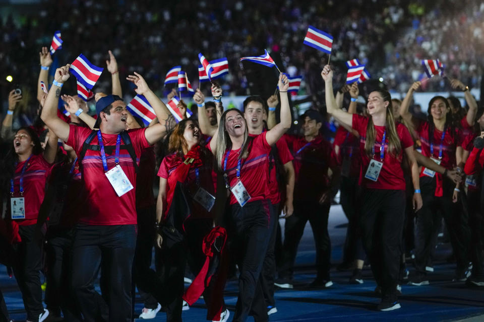 FILE - Costa Rican athletes parade at the Central American and Caribbean Games opening ceremony, at the Jorge "El Magico" Gonzalez stadium in San Salvador, El Salvador, June 23, 2023. The games drew athletes from 35 countries across the region. (AP Photo/Arnulfo Franco, File)