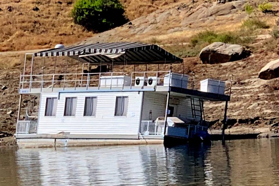 One of three house boats that took damage at Pine Flat Lake on Wednesday during a thunderstorm could be seen leaning the following day, June 23, 2022, the Pine Flat Lake Marina owner said.