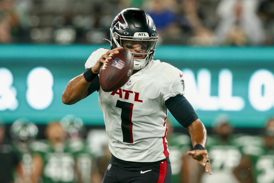 Atlanta Falcons quarterback Marcus Mariota (1) looks to pass on the run during the first half of an NFL football game against the New York Jets, Monday, Aug. 22, 2022, in East Rutherford, N.J. (AP Photo/John Munson)