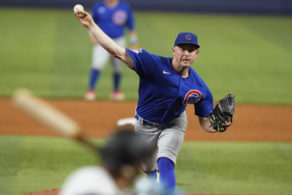 Chicago Cubs starting pitcher Adrian Sampson throws to Miami Marlins' Miguel Rojas during the third inning of a baseball game Tuesday, Sept. 20, 2022, in Miami. (AP Photo/Lynne Sladky)