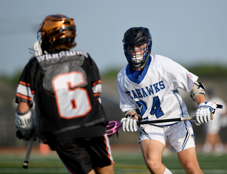 Decatur's Evan Oglesby (24) guards Easton's Hudson Royer (6) Monday, May 8, 2023, in Berlin, Maryland. Easton defeated Decatur 15-9 to win first Bayside lacrosse title in school history.