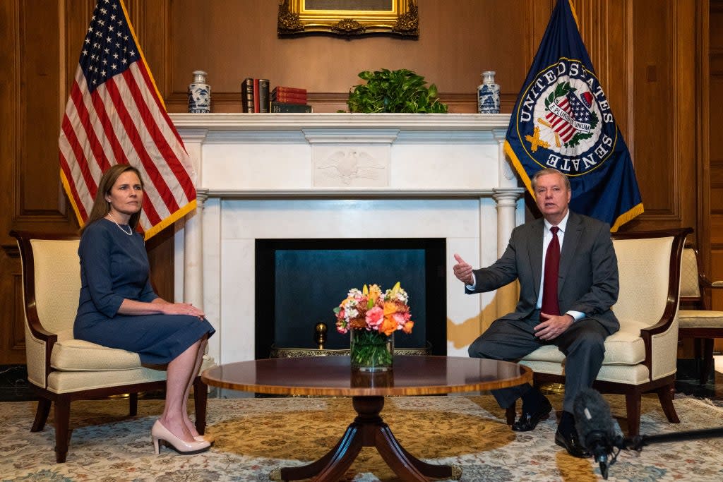 Voters in South Carolina are polarised about how Senator Lindsey Graham, right, has handled the Supreme Court nomination of Amy Coney Barrett. (Getty Images)