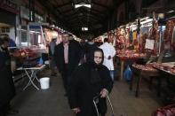 People make their way inside Athens' main meat market, February 12, 2015. REUTERS/ Alkis Konstantinidis