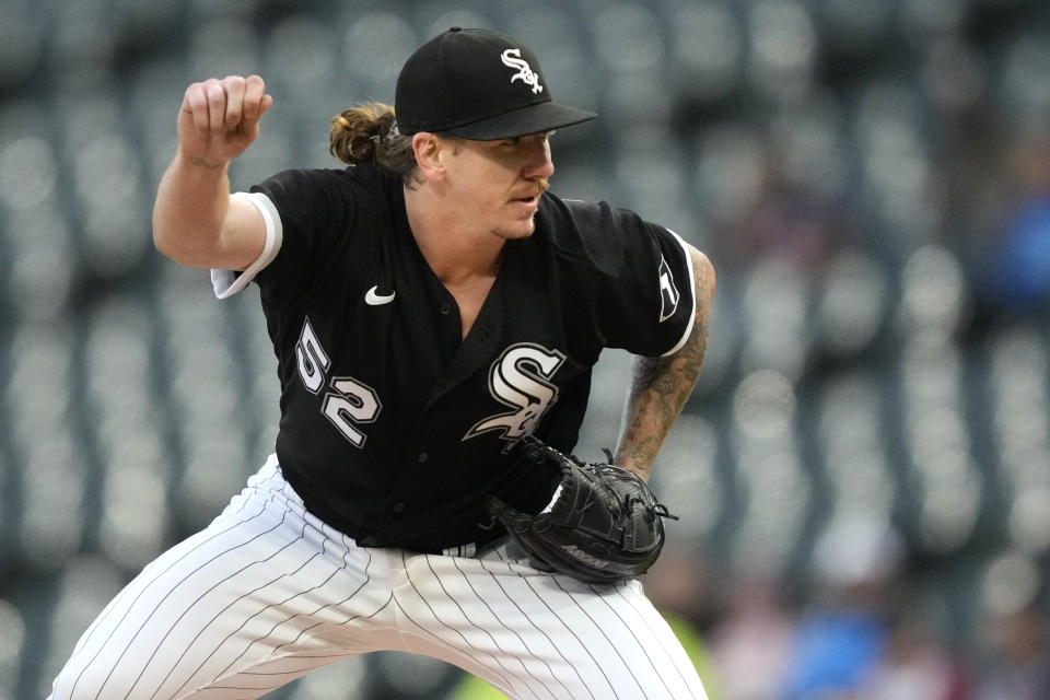 Chicago White Sox starting pitcher Mike Clevinger stretches his pitching arm during the first inning of the team's baseball game against the Cleveland Guardians on Wednesday, May 17, 2023, in Chicago. (AP Photo/Charles Rex Arbogast)