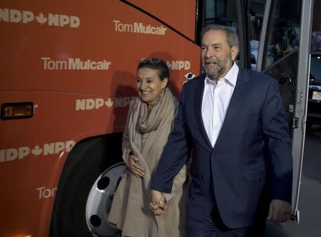 New Democratic Party leader Thomas Mulcair and his wife Catherine Pinhas arrive for the French language leaders' debate in Montreal, Quebec October 2, 2015. REUTERS/Christinne Muschi