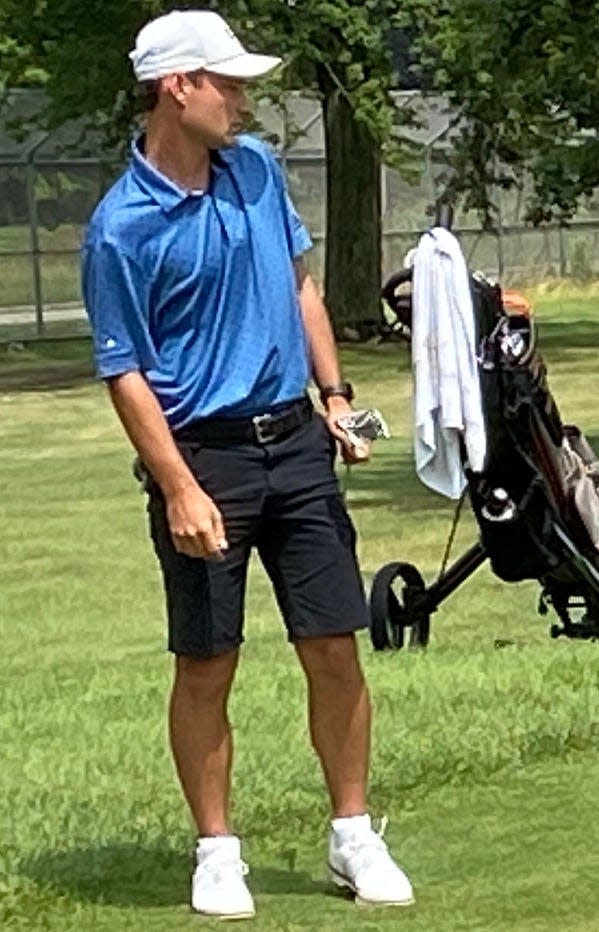 Mishawaka's Austin Christner encourages a birdie putt attempt from off the green to get close on the 195-yard, par-3 second hole during Sunday's second round at the East Course of Knollwood Country Club in the 99th Greater South Bend Men's Metro golf championships.