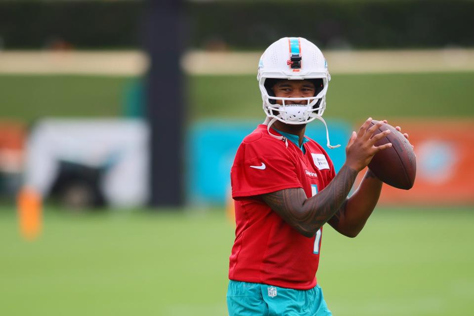 Jul 24, 2024; Miami Gardens, FL, USA; Miami Dolphins quarterback Tua Tagovailoa (1) throws the football during training camp at Baptist Health Training Complex. Mandatory Credit: Sam Navarro-USA TODAY Sports