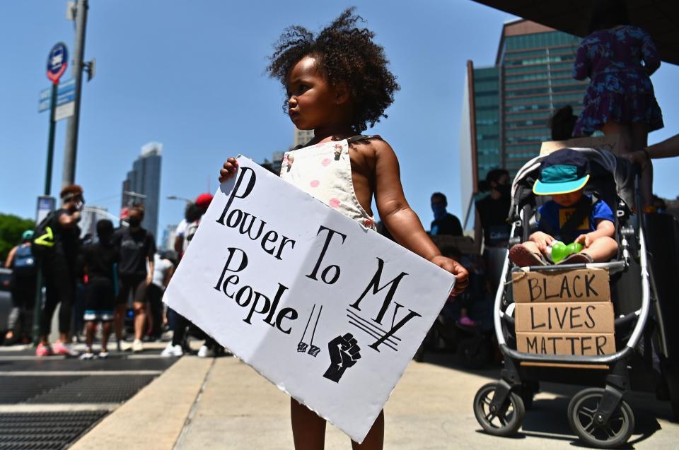 Families participate in a children's march in solidarity with the Black Lives Matter movement and national protests against police brutality on June 9, 2020 in New York City.