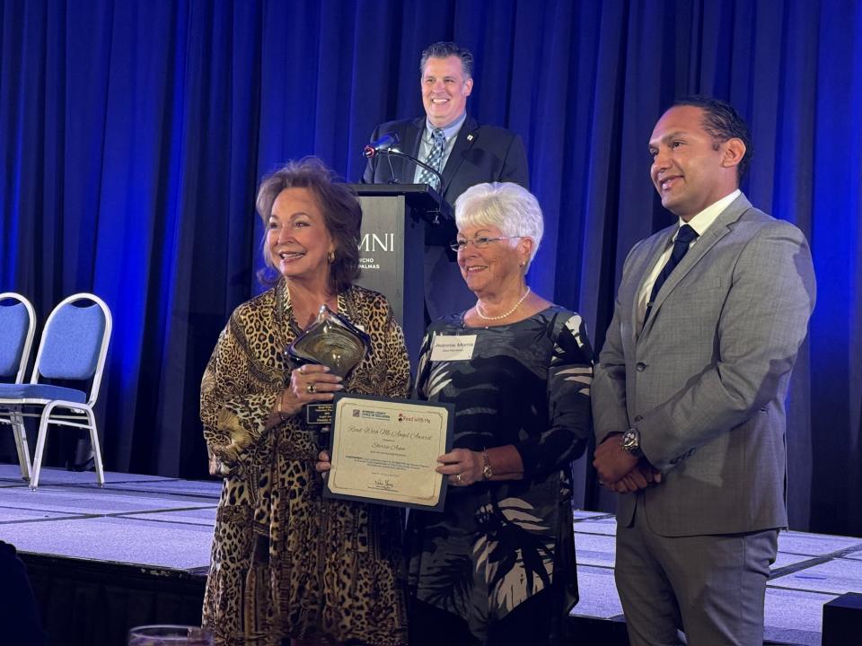 Sherrie Auen accepts the Angel of the Year Award from incoming RWM president Jeanie Morris and Edwin Gomez, Riverside County Superintendent of Schools, at the Read With Me Volunteers annual luncheon April 16, 2024.