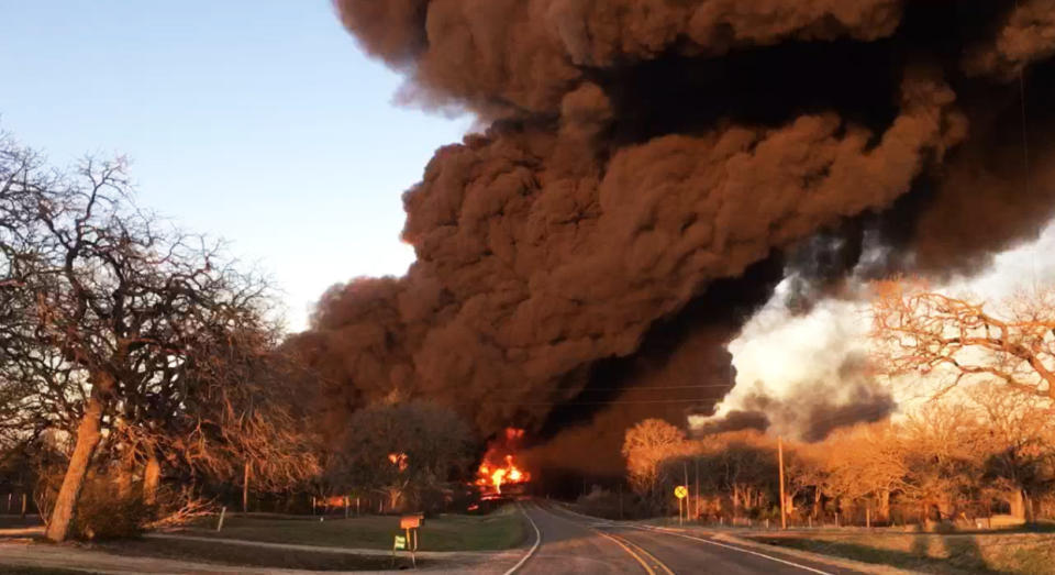 Smoke billows from a fire following an explosion caused by a crash between a train and an 18-wheeler near Cameron, Texas, on Feb. 23, 2021. (Milam County Sheriff Chris White)