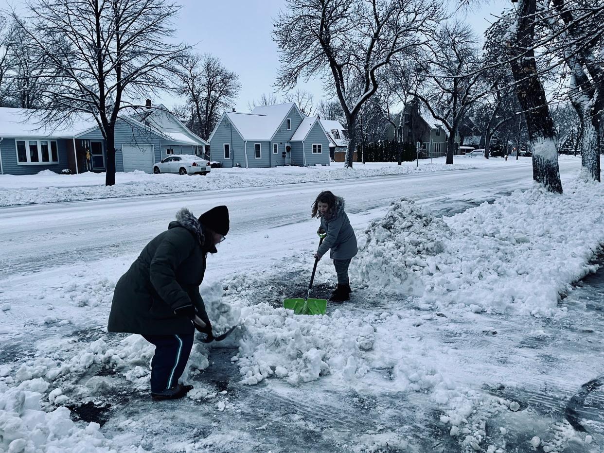 Brooke Lacher got some help clearing the driveway from her daughter Averie Wednesday morning. Aberdeen had 5 inches of snow by Wednesday morning with more snow in the forecast.