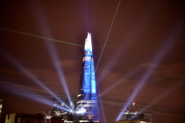 The Shard is seen lit up during a laser light show from Tower Millennium Pier on July 5, 2012 in London, England. The European Union's tallest building, designed by Italian architect Renzo Piano, stands at 310 meters tall situated on London's Southbank was formally inaugurated this evening with a laser show that was streamed live on the Internet. (Photo by Bethany Clarke/Getty Images)