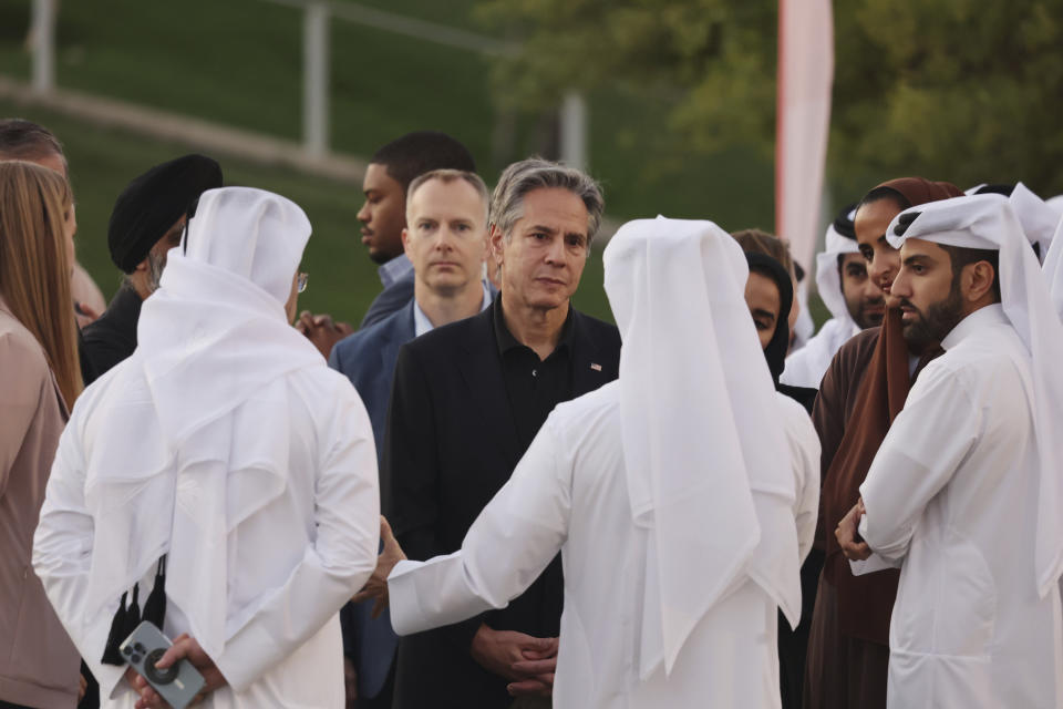 U.S. Secretary of State Anthony Blinken, center, listens to officials during a visit to Oxygen Park at Education City, in Doha Qatar, Monday Nov. 21, 2022. (Karim Jaafar/Pool via AP)