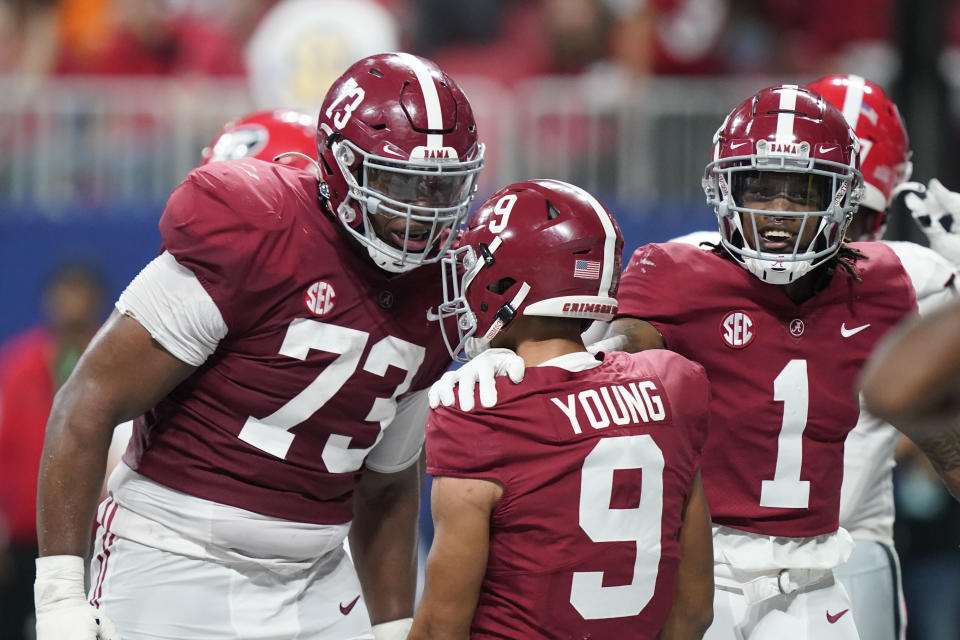 Alabama quarterback Bryce Young (9) celebrates his touchdown against Georgia during the first half of the Southeastern Conference championship NCAA college football game, Saturday, Dec. 4, 2021, in Atlanta. (AP Photo/Brynn Anderson)