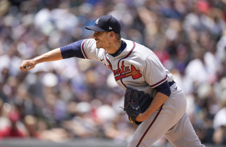 Atlanta Braves starting pitcher Charlie Morton works against the Colorado Rockies in the first inning of a baseball game Sunday, June 5, 2022, in Denver. (AP Photo/David Zalubowski)