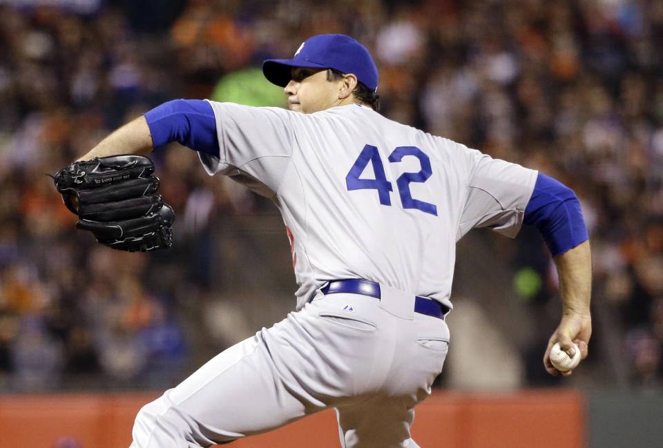 Los Angeles Dodgers starting pitcher Josh Beckett throws to the San Francisco Giants during the fourth inning of a baseball game on Tuesday, April 15, 2014, in San Francisco. (AP Photo/Marcio Jose Sanchez)