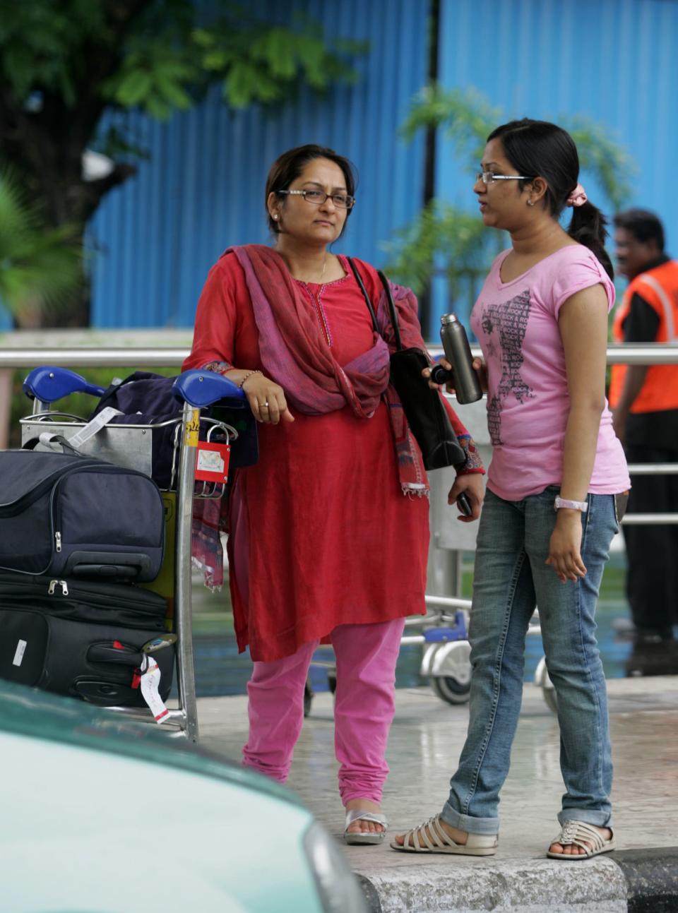 Women at an airport in Mumbai - Credit: Getty